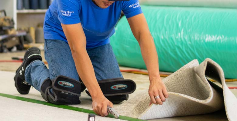 Workers cleaning, preparing and completing rugs and carpet in our workroom.